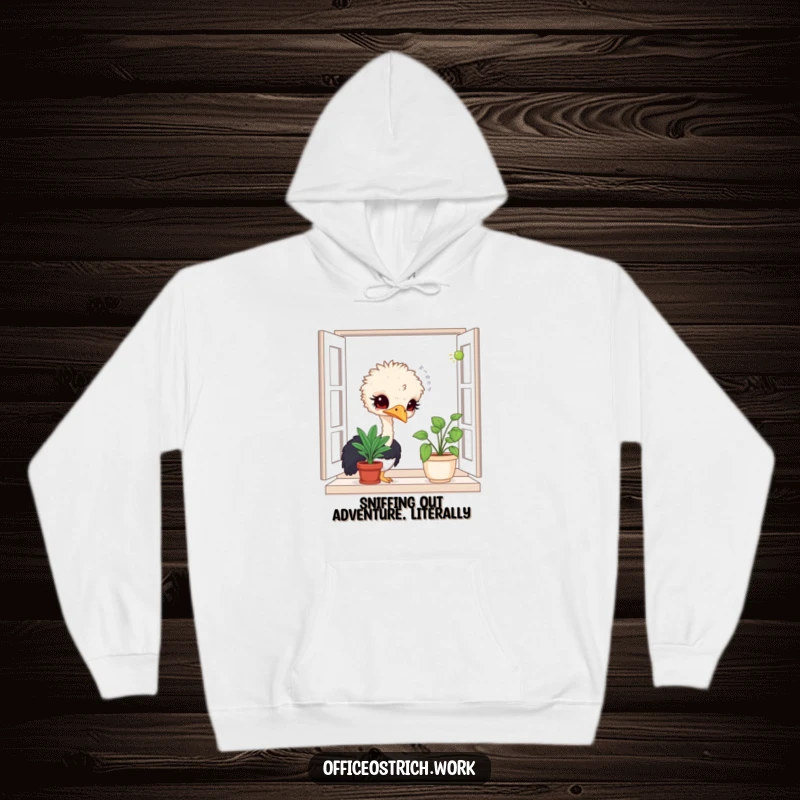 Funny hoodie depicting a curious ostrich character investigating a potted plant on a windowsill, full of wonder.