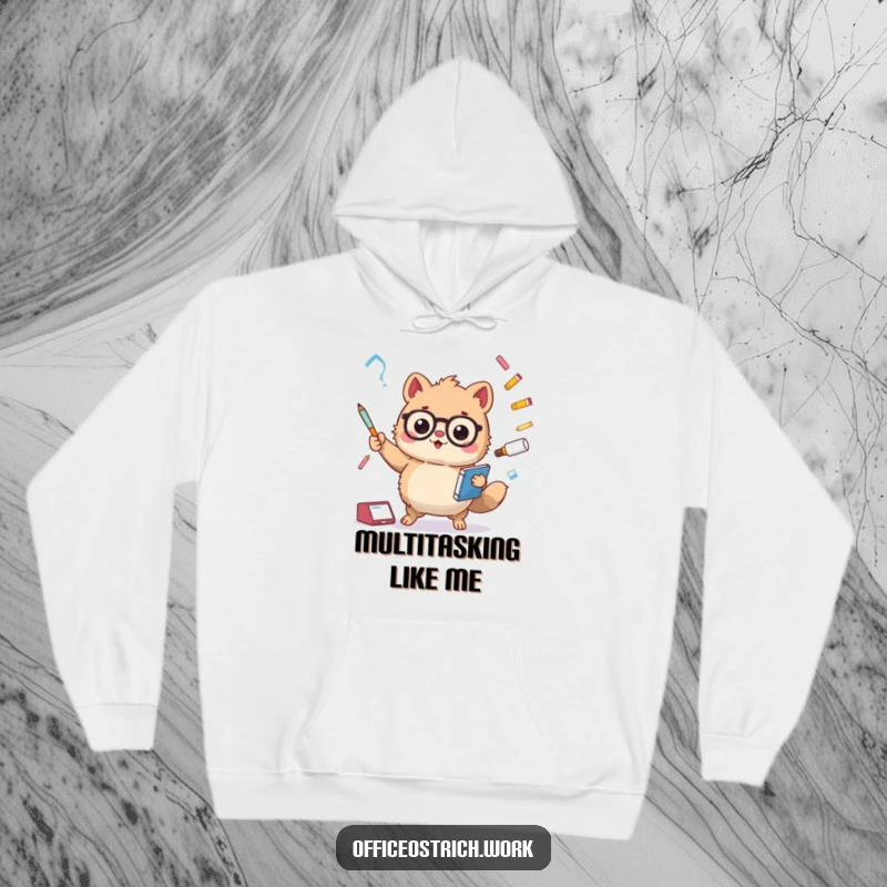 Funny fuzzy round animal character juggling oversized office items like a stapler and pens, on a soft and warm hoodie. Cozy work humor.