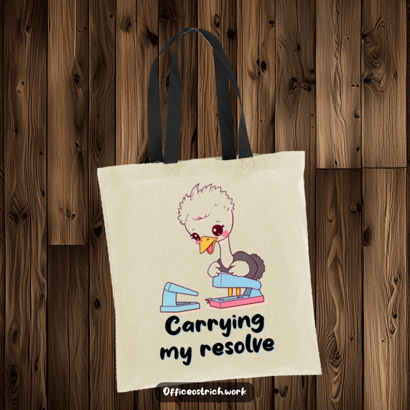 Funny tote bag with a cute ostrich character playfully pecking at a desk stapler, perfect for carrying essentials with a humorous office vibe.